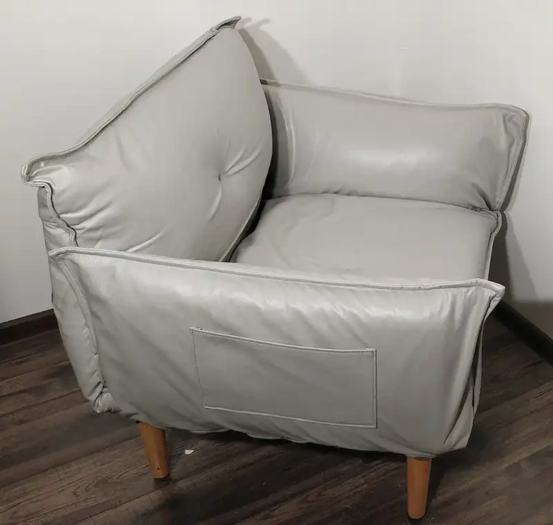 Sivé koženkové kreslo
